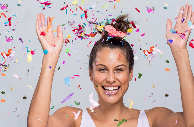 Woman with scrunchie and celebrating