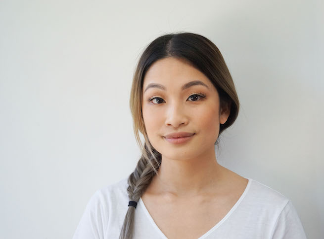 Front on shot of woman with a fishtail braid hairstyle