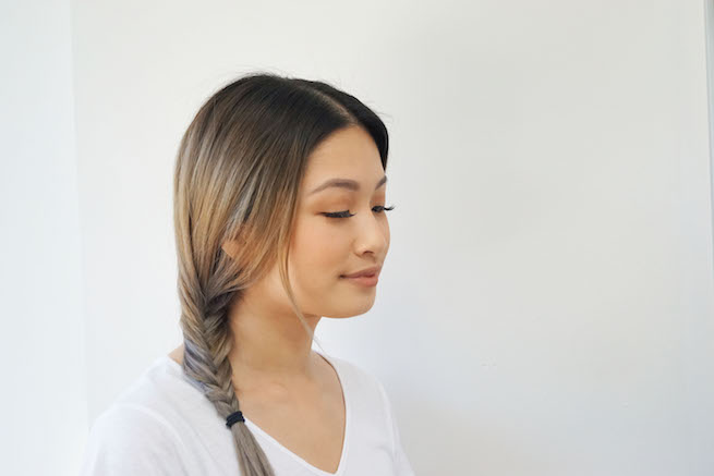 Profile shot of woman with a fishtail braid hairstyle