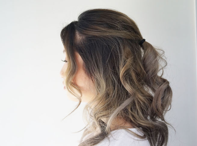 Profile photo of woman with half up half down hair style