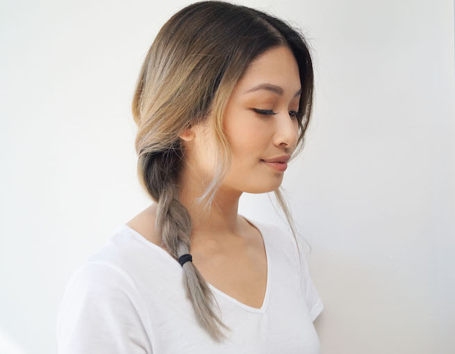 Profile shot of woman with side swept braid hairstyle